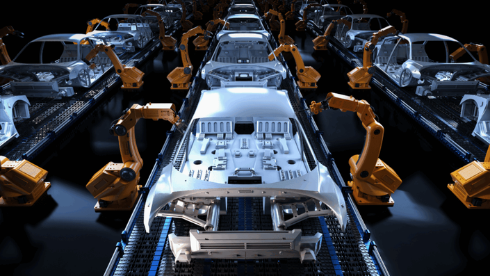 A modern, automated car assembly line with multiple orange robotic arms working on car bodies. The image illustrates the industrial strength of the German automotive sector, a key component of the DAX index.