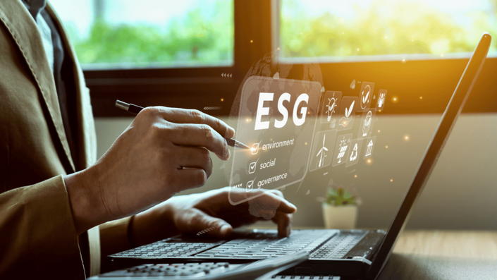 Person selecting ESG investments in Germany with a digital interface showing environmental, social, and governance icons.