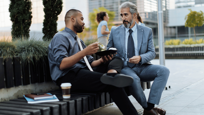 Mentor and mentee having a one-on-one outdoor conversation during a Networking session.