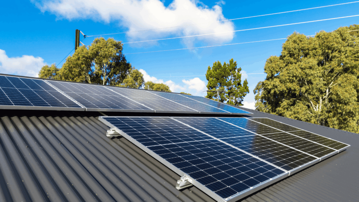 A rooftop with solar panels, symbolizing Green Bonds financing renewable energy projects that contribute to a sustainable future.
