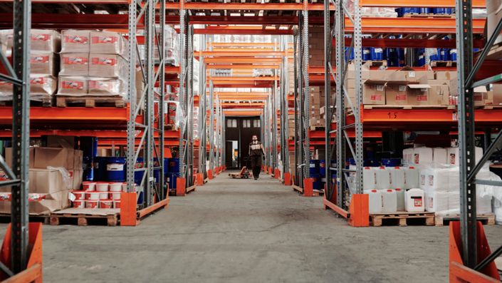 A well-organized warehouse with shelves stocked with products, representing efficient logistics for e-commerce businesses.